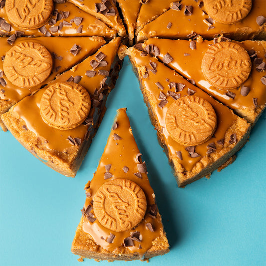 gooey Biscoff cookie dough pie packed with milk chocolate spread and topped with Biscoff biscuits